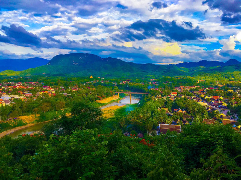 Hike up to Phousi Mount peak and enjoy the view during Laos tours
