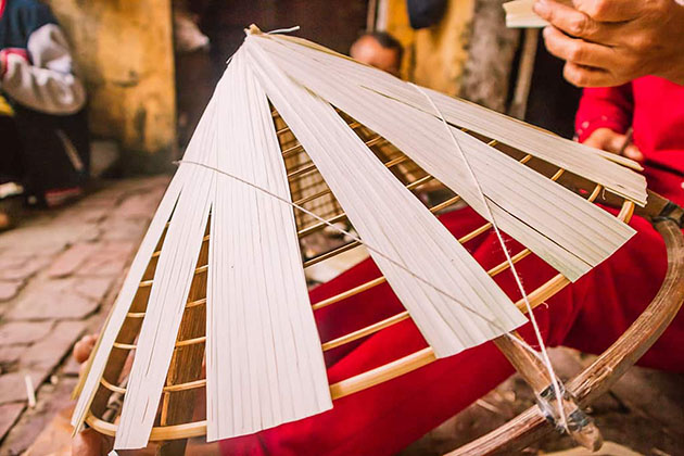 Step by step, the conical hat-making process is a work of art in motion