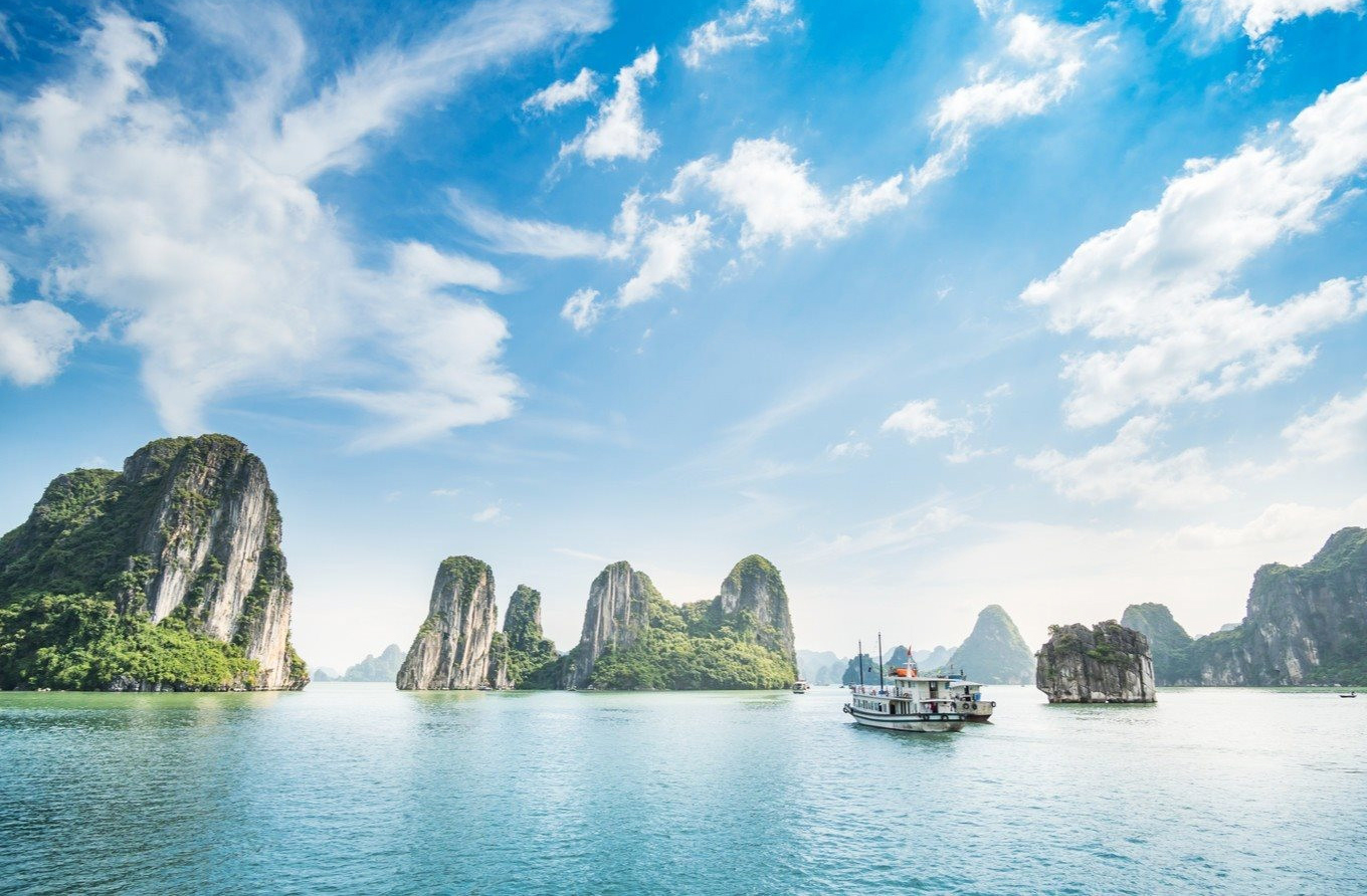 The sun rising over Halong Bay is like a kaleidoscope of dreams - vietnam and cambodia holidays