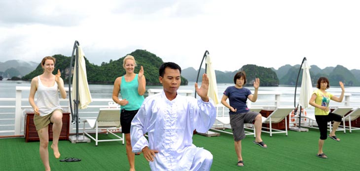 Rejuvenate and reset your mind and body with a sunrise Tai Chi session in stunning Halong Bay