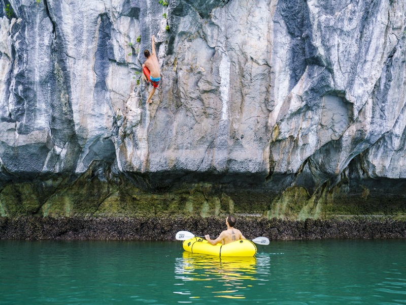 Nothing says adventure quite like climbing up the towering cliffs of Halong Bay