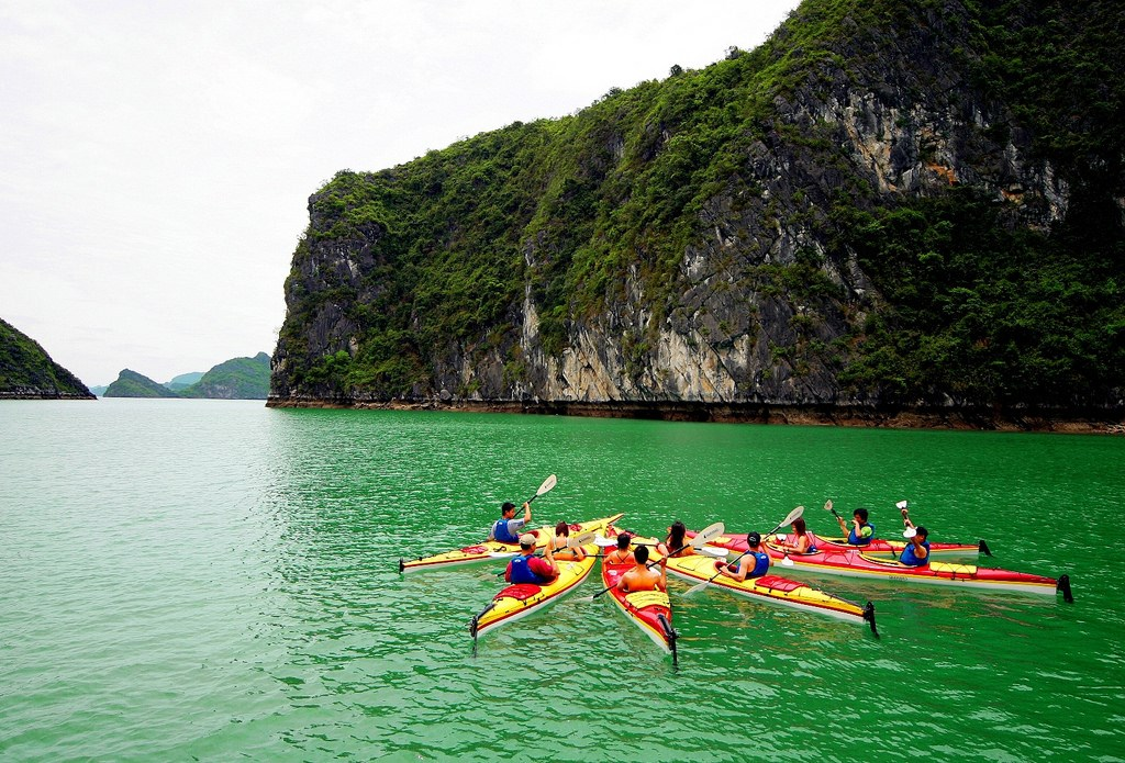 Ready for an unforgettable adventure, Experience the beauty and serenity of Halong Bay as you glide through a floating paradise by kayak - halong bay tour hanoi