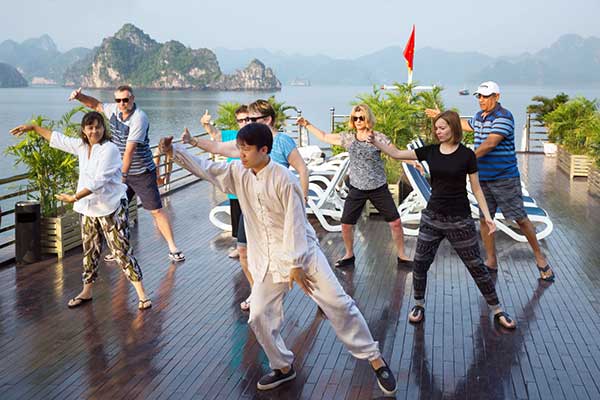 Take a break from the hustle and bustle of everyday life by finding your center with tai chi in Halong Bay