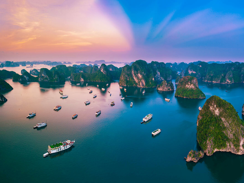 Take a moment to admire the beauty of Ha Long bay - with its majestic soaring limestone islands, turquoise waters and lush greenery, it's truly an experience like no other