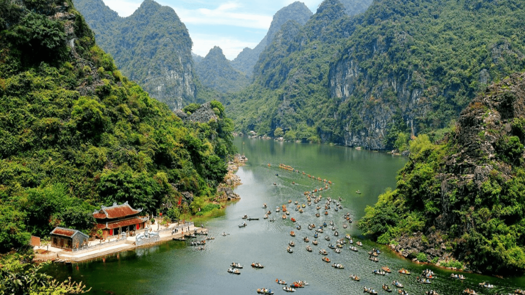 Be transported to another world when you visit Ninh Binh, Vietnam. With towering limestone mountains, mysterious caves - vietnam vacation destinations