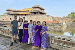 Tourists taking a photo in front of Ngo Mon Gate at the Imperial City of Hue, Vietnam